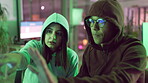 Hacker, people and cybercrime in office, night and discussion of couple, identity theft and malware. Hoodie, pointing and criminals in rush, digital and stealing of info for ransomware and coding