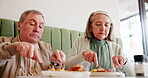 Elderly couple, eating and breakfast in restaurant for love, relationship and morning with partner on weekend. People, hungry and food in cafe for marriage, brunch and bonding with relax on date