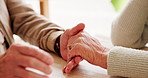 Holding hands, love and elderly couple by table for support, sympathy or condolences for loss. Unity, home and senior man and woman with connection for trust, commitment and care in marriage bonding.