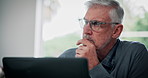 Senior man, author and thinking with laptop for story, beginning or end on digital novel or ebook at home. Mature, male person or writer with computer in wonder, contemplating or thought for editing