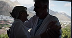 Elderly couple, holding hands and dancing with music for holiday, vacation or spa day at nature resort. Senior man, woman or lovers enjoying bonding time, love or romance together at luxury hotel