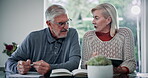 Paperwork, tablet and elderly couple with discussion at table for financial, loan and insurance bills. Senior people, retirement and home with tech for pension fund, healthcare debt and online budget