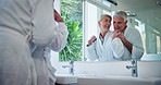 Hug, senior couple and morning in hotel bathroom with mirror, commitment and trust together from marriage. Relax, calm and people on anniversary with love, support and romance with weekend away