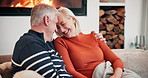 Sofa, forehead touch and senior couple by fire for bonding, relationship and commitment. Home, marriage and happy man and woman embrace on couch for romance, care and relax together in living room