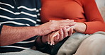 Love, holding hands and senior couple on sofa for bonding, relationship and commitment. Home, marriage and closeup of man and woman on couch for romance, care and relax together in living room