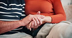 Love, holding hands and mature couple on sofa for bonding, relationship and commitment. Home, marriage and closeup of man and woman on couch for romance, care and relax together in living room