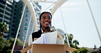 Business woman, box and happy for new job in city with documents, excited and vision for future career. African person, smile and low angle with cardboard package with paperwork on bridge in Kenya