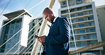 Business, city and black man with phone for travel for communication, typing email and networking. Professional, corporate and worker on smartphone for internet, website or social media in urban town