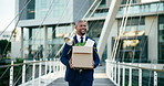 City, excited and business black man with box happy for interview success, opportunity and onboarding. Corporate, professional and person in urban town for recruitment, hiring and first day at office