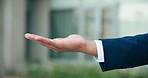 Person, hand and offer, sharing opportunity or financial aid outside office. Businessman, employee and asking for help, borrow or salary increase at workplace for promotion or investment support
