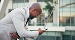 Phone, city and business black man on bridge for contact, typing email and networking outdoors. Professional, corporate and worker laugh on smartphone for internet, website and social media in town