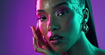 Neon lights, cosmetics and face of woman with glow in studio with beauty, creativity and vibrant color. Makeup, jewelry and portrait of model from Cuba with art self expression by purple background.