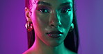 Woman, face or neon in studio with makeup, beauty or cosmetics with cyberpunk aesthetic. Model, portrait or confident on purple background with luxury accessory, unique hairstyle or glow in Colombia