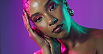 Girl, face and neon in studio for beauty, makeup and cosmetics with cyberpunk aesthetic. Woman, portrait and confident on purple background with luxury accessories, unique hairstyle and light glow