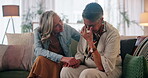 Senior couple, women and crying for support, comfort and relationship in living room with love or care. Elderly people, embrace and sad in house for LGBTQ, empathy and gay partner with helping hands