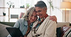 Mature, lesbian couple and tablet with hug in home on sofa with social media scroll, watching video or relax. Lgbtq, people and romance with commitment, movie review or trust in relationship on couch