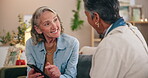 Home, mature and lesbian couple with phone, news and connection for social media or digital app. People, conversation and women on sofa speaking with mobile for online shopping or website information