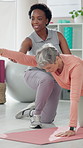 Senior woman, physiotherapist and stretching arms on exercise mat for support, care or progress at clinic. People, physical therapy and rehabilitation for helping hand, recovery or muscle development