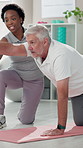 Senior man, physiotherapist and exercise for arms on floor for support, stretching and progress at clinic. People, physical therapy and rehabilitation for helping hand, recovery or muscle development