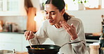 Woman, cooking and smell food in kitchen for meal prep, healthy lunch and nutrition of morning breakfast. Smile, female person and aroma of vegetables in for vegan process, salad ingredient and house