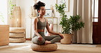 Woman, yoga and meditation for peace in home on tatami cushion, floor or eyes closed for breathing. Girl, person and mindfulness in morning for zen balance, chakra or wellness in living room at house