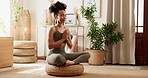 Woman, yoga and namaste for peace in home on tatami cushion, floor and mindfulness with breathing. Girl, person and meditation in morning with zen balance, chakra and wellness in living room at house