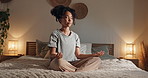 Woman, yoga and lotus on bed, peace and chakra in home, mindfulness and relax in pyjamas at night. Girl, person and eyes closed with meditation, zen and balance with breathing in bedroom at apartment