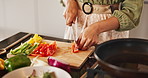 Home, hands and woman with vegetables for cutting, chop and preparation for healthy diet in kitchen. Culinary, female person and above with food for cooking, frying and nutrition meal with peppers