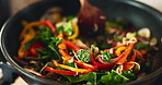 Closeup, spoon and cooking in house for brunch, eating and health with nutrition, flavor and stir fry. Frying, pan and person in kitchen for healthy breakfast, meal prep or food with diet in morning 