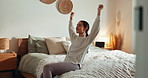 Back, freedom and stretching with woman in bedroom of home at night to relax for wellness. Peace, sleeping and smile with happy or lazy person on bed in apartment for evening break, comfort and rest