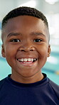 Boy, happy and child at swimming pool with fitness for training lesson, workout and practice break. Portrait, black kid and smile for sports challenge, tournament and swimmer program at indoor centre