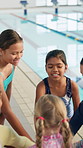 Group, hands or happy kids in huddle for swimming at school for sports fitness, aquatic learning or success. Goal, team or instructor with children for performance target or skill development in pool