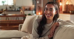 Woman, face and laughing on sofa in home with relax, confidence and comfortable in cozy apartment. Girl, person and funny in portrait on couch with resting, break or satisfied in living room of house