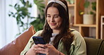 House, typing and woman on sofa, smartphone and smile with message to contact, network and relax. Cellphone, person or girl on couch, mobile game and online reading with chatting, funny or connection