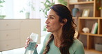 Woman, drinking water and exercise in home on break, reflection or happy on floor for fitness. Person, bottle and thinking for wellness, detox and hydration for training, workout or health in morning