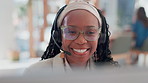 Black woman, glasses and talking in call center for customer support, telemarketing and FAQ in office. Agent, smile and headset at help desk for friendly service, guide and technical advice with tech