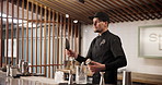 Bartender, man and cocktail mixer with ice, flip and speed for service, catering and metal container. Person, waiter or barman with tricks, talent and balance with juggling, drinks or alcohol at club