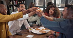 Cheers, friends and pizza in restaurant, group and bonding with food, sharing and communication on table. Reunion, hospitality and people with alcohol, glass and celebration for promotion and talking