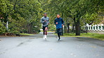 Men, running chat and park with marathon training, sport and athlete on jog for fitness outdoor. Path, cardio and friends back with exercise and workout for health and wellness in winter on road