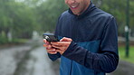 Hands, phone and happy man outdoor for fitness, scroll results and laugh at exercise meme. Mobile, sports and runner in nature for health information, location search and update schedule on internet