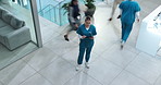 Tablet, nurse or woman in busy hospital with chart, results or healthcare schedule for clinic management. Thinking, planning and medical professional in lobby with folder, checklist and digital app
