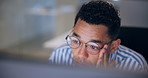 Man, glasses and reading on computer for business, thinking and programming. Web designer, prescription specs and tech in office for software development, research and blue light lens for protection