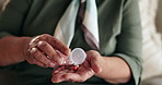 Pills, hands and senior woman with medication for treatment of parkinsons, tremors or sickness. Healthcare, illness and closeup of female person with tablets medicine for healing in retirement home.
