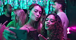 Selfie, neon and night with women in club for new years eve party, celebration and concert. Friends, profile picture and music with people on dance floor for memory, social event and festival