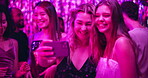 Selfie, friends and party with women in club for new years eve night, celebration and concert. Neon, profile picture and music with people on dance floor for memory, social event and festival