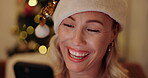 Christmas, woman and laughing with phone in home for social media meme, online joke and funny text message. Person, happy and relax with smartphone in house at night for charity donation and holiday