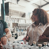 Inspection, factory and distillery with people and bottle for ...