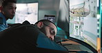 Cyber security, tired and government man sleeping in control room with stress and command center break. Confidential, surveillance with global video data with burnout and late night work with nap