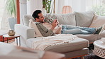 Home, smile and man with cellphone, typing and internet for social media, connection and funny. Happy person, apartment and guy with comfort, smartphone or digital app for email, chatting or laughing