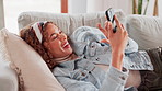 Home, funny and woman with cellphone, typing and internet for social media, connection and joke. Happy person, apartment and girl on sofa, smartphone or digital app for email, humor or online comedy